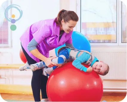 Child playing with a red balloon while receiving assistance, coordination and balance issues