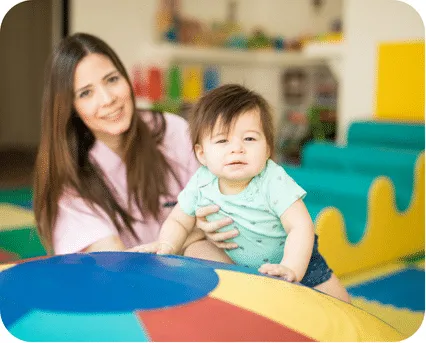 Infant receiving care from a paediatrician, physiotherapy at home