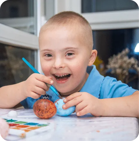 Child playing with a variety of toys