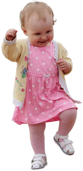 A charming, smiling child making an effort to walk on her own, walking issues
