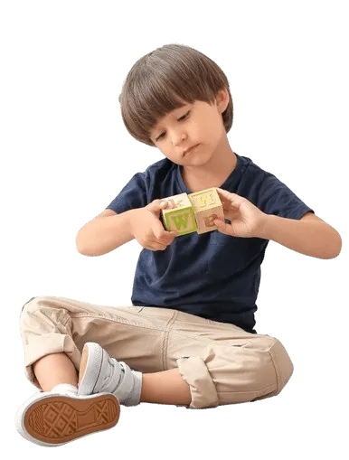 Child playing with a Lego-like building set