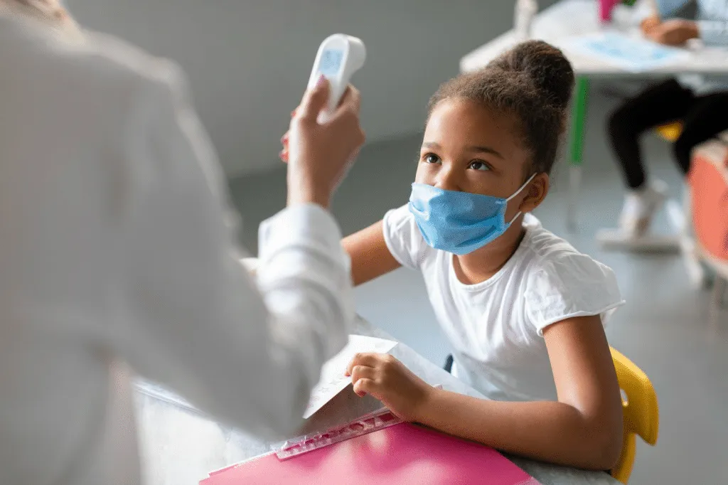Physiotherapist checking young child at paediatric physical therapy clinic