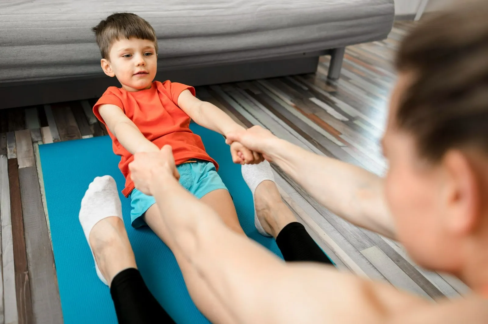 Child doing physiotherapy exercises through play based learning in early childhood at home