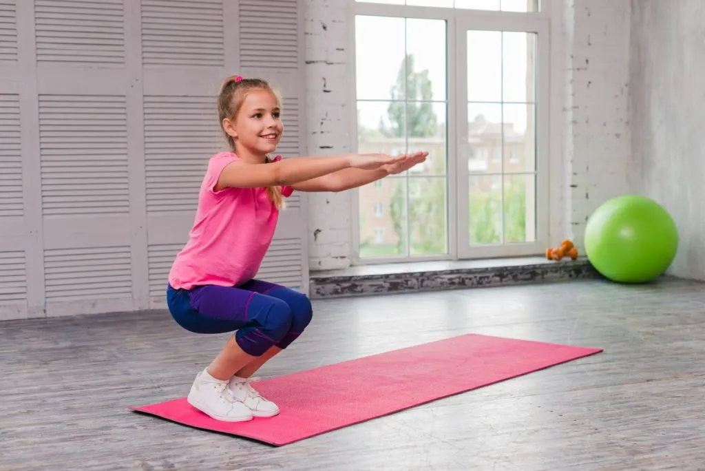 Girl improving balance and coordination through fun physical activity for kids indoors
