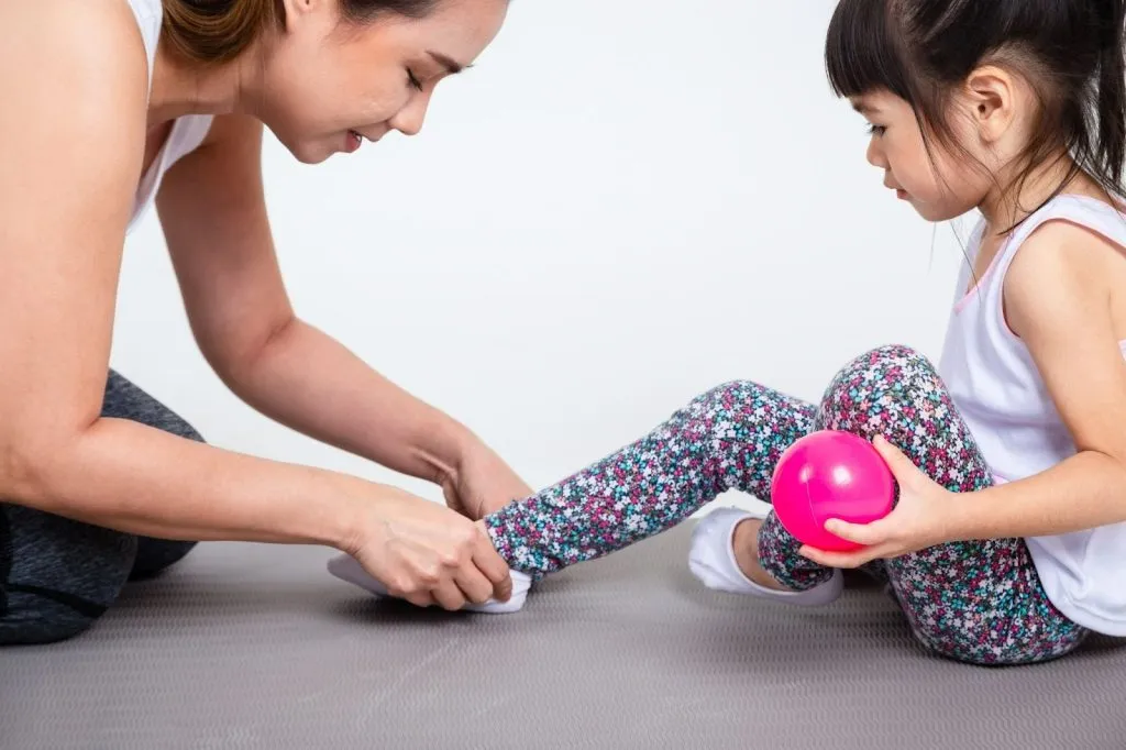 Paediatric physiotherapist using play based learning in early childhood to improve coordination and balance
