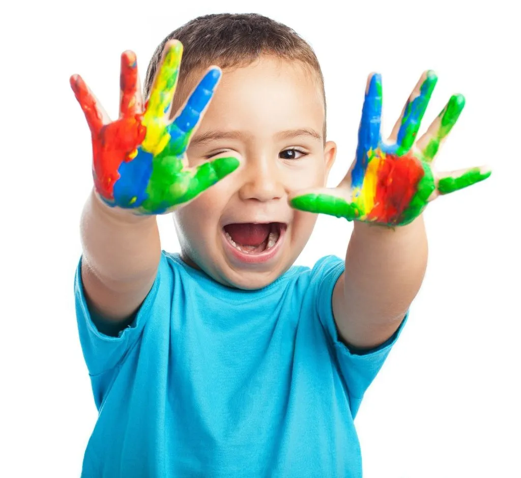 Child expressing creativity and confidence through ASD early intervention activities